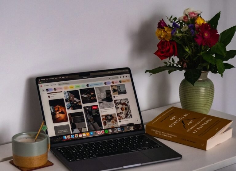 Laptop and books for indie author marketing articles