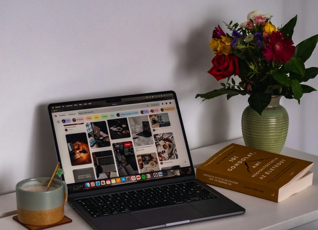 Laptop and books for indie author marketing articles
