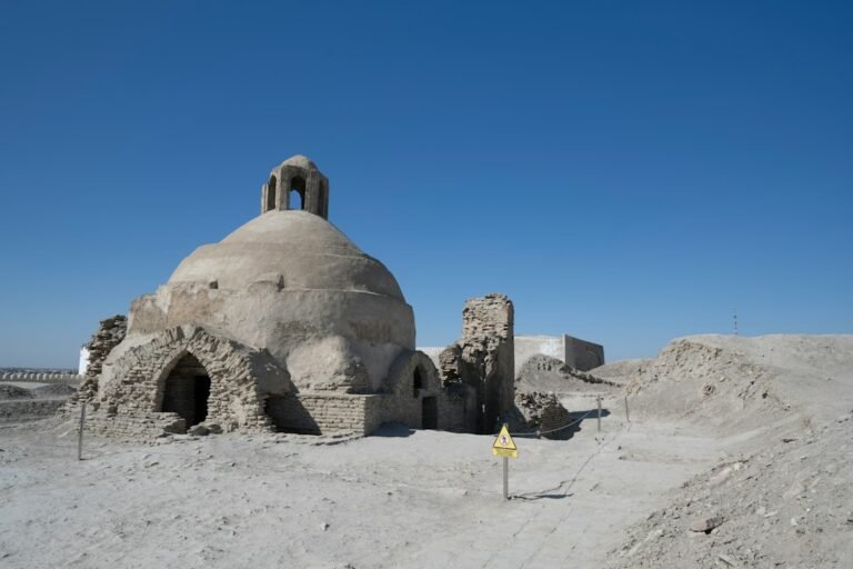Ancient brick ruins in a Central Asian desert landscape representing Merv