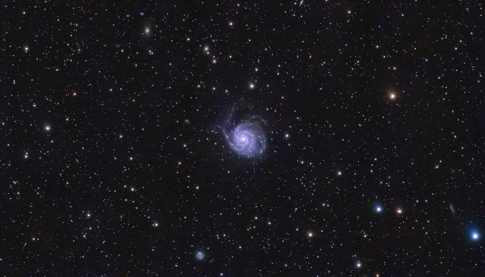 Spiral galaxy surrounded by stars in deep space